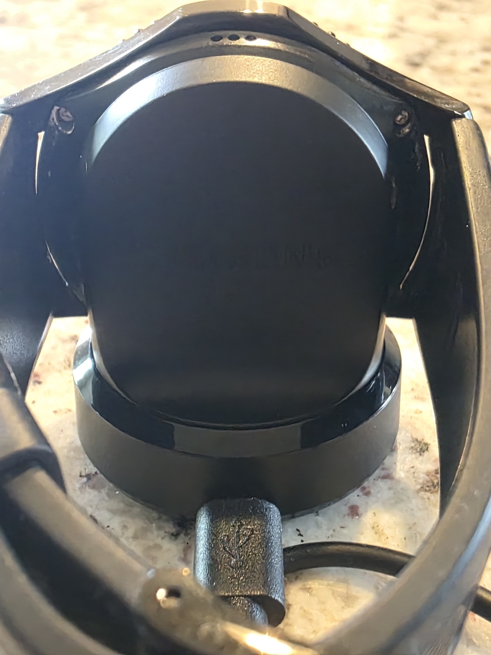 Black Round Samsung Smartwatch on Charging Dock - Picture 3 of 4